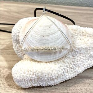 47. Handmade Antigua Seashell Pendant Necklace with Clear Bead Accent